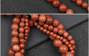Macro detail of sparkling reddish-brown golden sand stone beads for DIY jewelry making