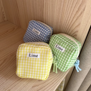Set di 3 borse per assorbenti in cotone a quadretti nei colori giallo, verde e blu con zip