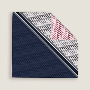 Detail of silk square scarf showing navy and red geometric prints with subtle glitter