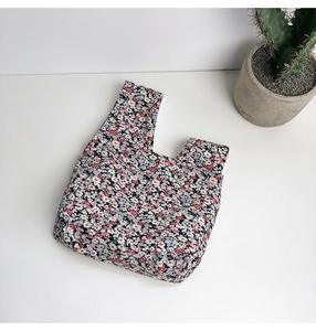 Close-up of Japanese floral pattern wrist bag with detailed cotton fabric texture