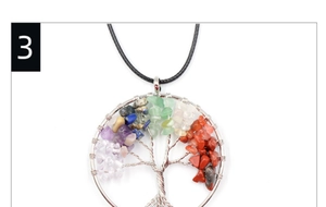 Macro shot of handmade Tree of Life pendant featuring colorful natural healing stones