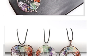 Detail of handmade Tree of Life pendants with copper wire and colorful natural stones