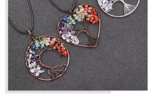Detailed close-up of handmade copper tree of life pendants with colorful natural stones