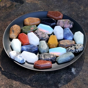 Miniature coffin-shaped natural crystal stones collection for Halloween decor