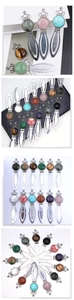 Detail of vintage crown bookmarks with natural crystals on a black notebook