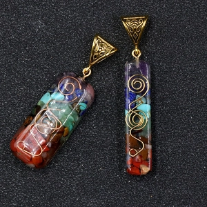 Natural Seven Chakra stone pendant necklace with gold wire wrapping in resin casing