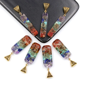 Seven chakra resin necklace with colorful natural crushed stones and golden wire wrap