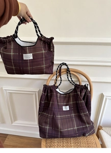Detailed comparison of large and small brown plaid tote bags with woven rope handles