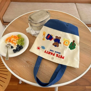 Canvas lunch tote bag with colorful animal embroidery and navy blue handles
