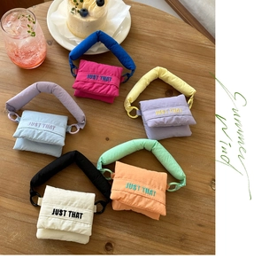 Quilted cotton mini bag display in multiple colors with JUST THAT embroidery detail