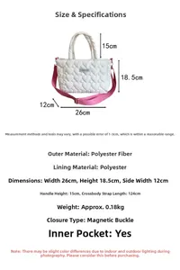 Detailed spec view of a white heart quilted handbag with pink strap and size labels