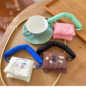 Three mini padded tech bags with cute cartoon prints and thick cotton-filled straps