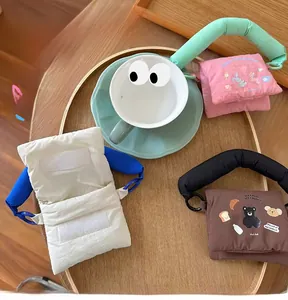 Detailed close-up of soft padded cotton mini bags with velcro closure and hand strap