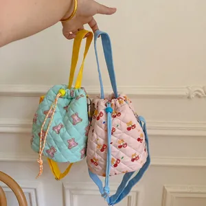 Quilted bucket bags with cute bear and cherry patterns in macaron candy colors