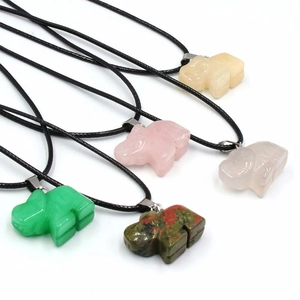 Natural crystal elephant pendants in rose quartz and aventurine with black cords
