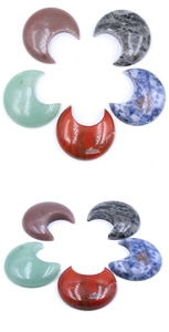 Detailed view of polished natural crystal stones in crescent moon shape, various colors
