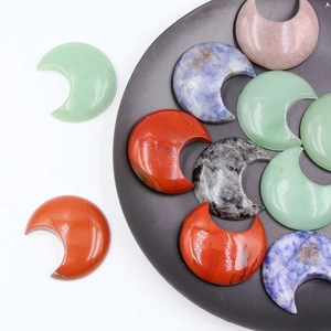 Polished natural stone moon carvings in various colors for home decor and healing