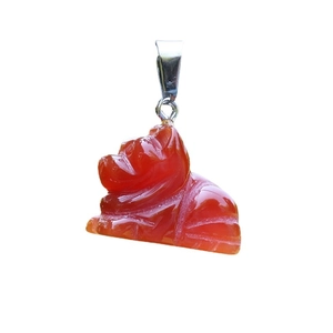 Handcrafted red agate sun bear pendant with a silver bail on a clean white background