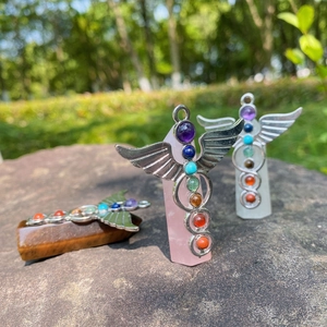 Set of three healing crystal angel pendants with chakra beads on natural stone hexagonal pillars