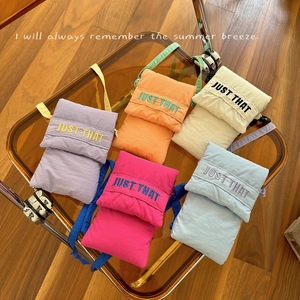 Quilted nylon crossbody phone bags in five vibrant colors with 'JUST THAT' embroidery