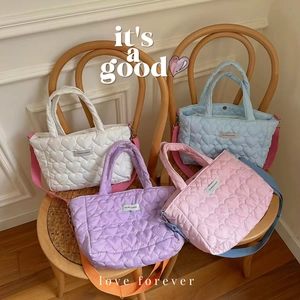 Quilted heart handbag collection in soft pastel colors with detachable shoulder strap