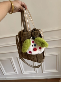 Detail of coffee teddy fleece tote with cute cartoon plush and striped handle