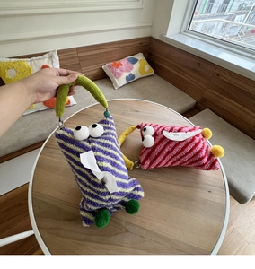 Detail of furry striped monster car tissue holders with soft faux rabbit fur and handles