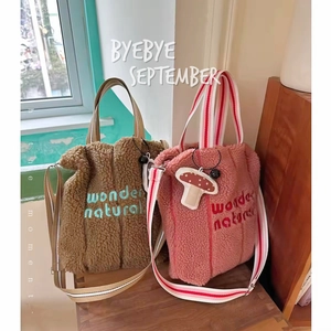 Lamb wool tote bags in brown and pink with wonder embroidery and adjustable straps