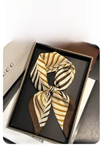 Detail of 70cm square faux silk scarf with elegant brown and champagne V-shaped stripes