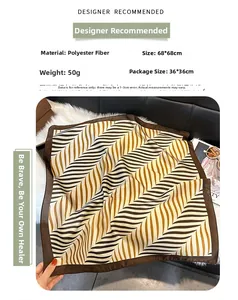 Close-up of 68x68cm square scarf featuring brown striped patterns and polyester texture