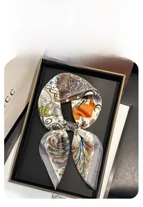 Detailed view of silk-textured square scarf featuring retro artistic animal prints