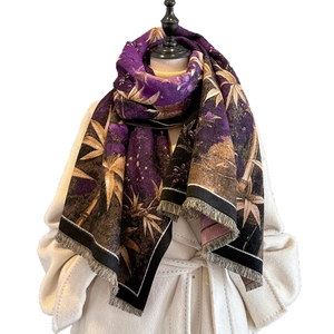 Thick cashmere-like scarf with vintage bamboo leaf jacquard and tassels on a white coat
