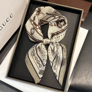 Detail of elegant 70cm satin scarf with paisley and horsebit patterns in silk texture