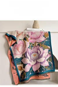 Detail of elegant lotus jacquard shawl with fringe on a minimalist fireplace mantel