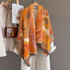 Vintage reindeer jacquard pashmina shawl with fringes in warm orange and brown tones