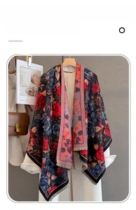 Close-up of vintage rose pattern scarf with fringe on a white wool coat display