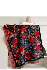 Detailed view of floral rose jacquard scarf with decorative fringes and soft texture