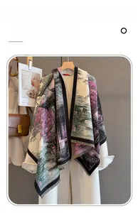 Detailed view of imitation cashmere scarf with oriental landscape print and fringe edges