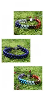 Detailed macro view of handmade braided natural stone energy bracelets with vintage metal beads