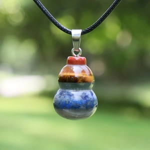 Natural crystal stone Wu Lou pendant with chakra layers on a black cord necklace