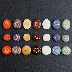 21-piece chakra natural stone set with golden engraved symbols on polished crystals
