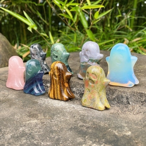 Polished natural crystal ghost figurines in various gemstones for Halloween decor