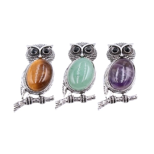 Three owl pendants in tiger eye, aventurine and amethyst stones on silver setting