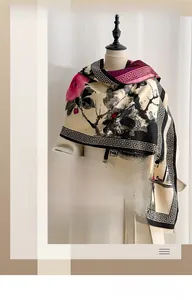 Detail of vintage plum blossom jacquard scarf with ink wash style and soft fringe trim