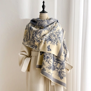 Detail of winter thick pashmina shawl featuring blue French landscape print and frayed edges