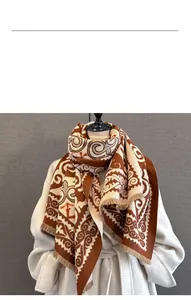 Close-up of thick winter scarf featuring vintage geometric jacquard and cashmere feel