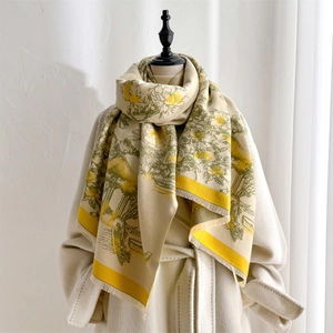 Detailed macro view of pastoral landscape pattern and soft fringe on the beige scarf