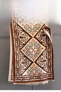 Detailed view of intricate vintage jacquard pattern on a thick winter ethnic shawl