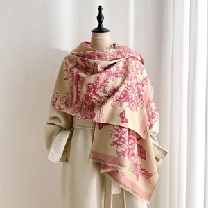 Detail of pink floral landscape print on beige thick winter pashmina with fringe edges