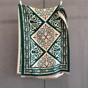 Winter geometric jacquard scarf with ethnic patterns and tassels in vintage green